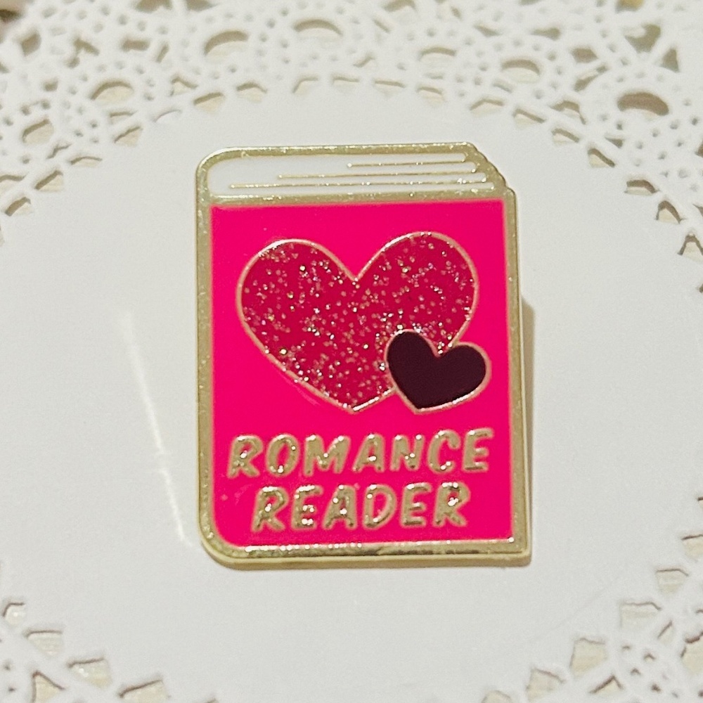 Romance Reader Pink Enamel Pin with Sparkling Hearts.
